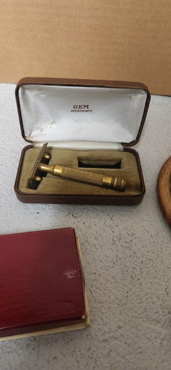 Sale Photo Thumbnail #157: Antique glasses, razors, curling iron, mirror....one of those razors have ivory on one side and what looks like tusk (?) on the other.