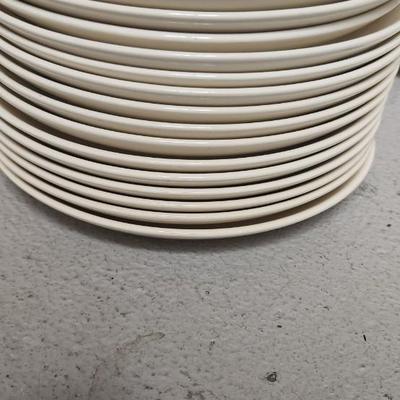 Mess of dessert plates and a new jersey turnpike souvenir