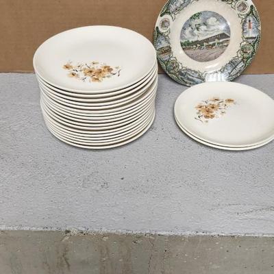 Mess of dessert plates and a new jersey turnpike souvenir