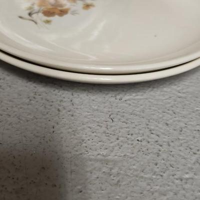 Mess of dessert plates and a new jersey turnpike souvenir