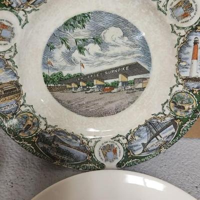 Mess of dessert plates and a new jersey turnpike souvenir