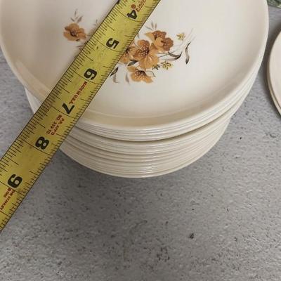 Mess of dessert plates and a new jersey turnpike souvenir