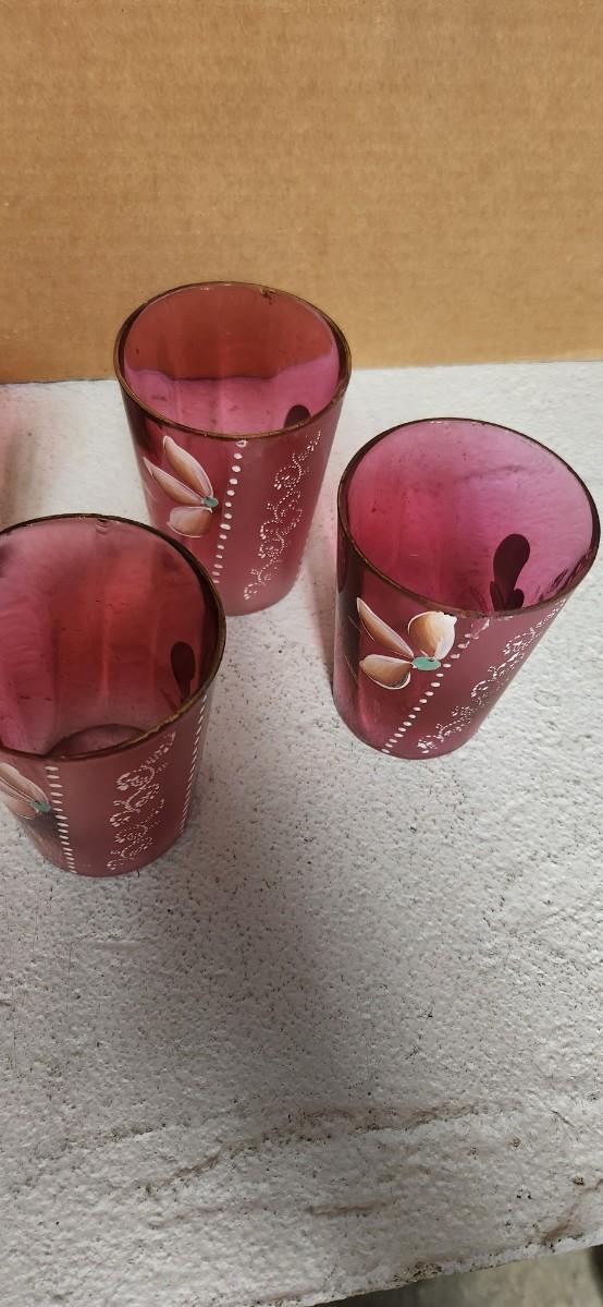 Sale Photo Thumbnail #200: Gorgeous Victorian cranberry pitcher and glasses with enamel paint. The pitcher is in excellent condition, the glasses are chippy