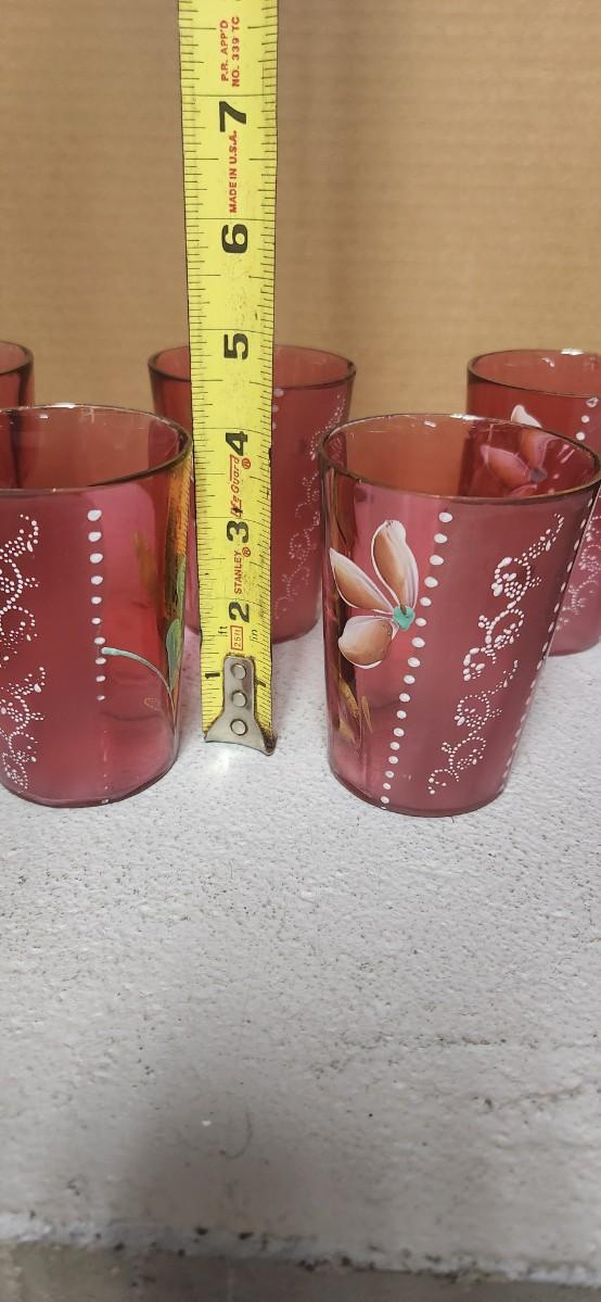 Sale Photo Thumbnail #202: Gorgeous Victorian cranberry pitcher and glasses with enamel paint. The pitcher is in excellent condition, the glasses are chippy