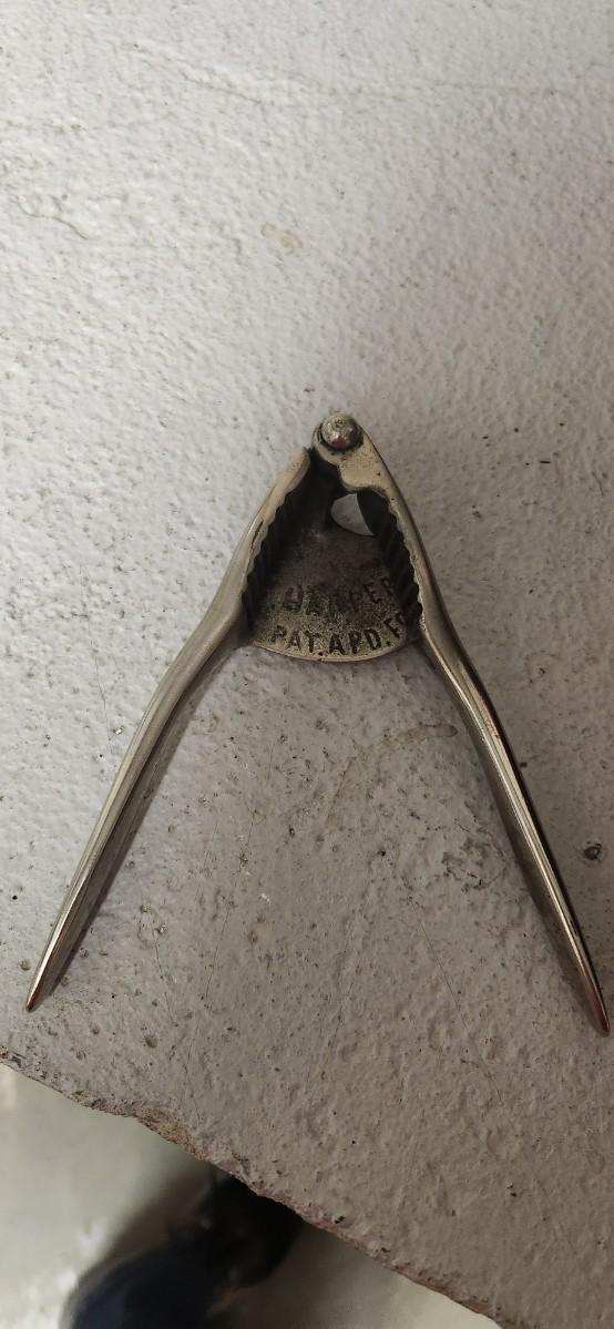 Sale Photo Thumbnail #292: Couple bean pots, a nutcracker, the inside of a big butterchurn and a krumkake iron