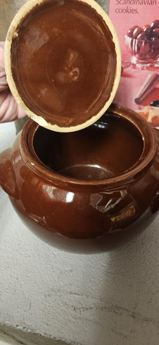 Sale Photo Thumbnail #293: Couple bean pots, a nutcracker, the inside of a big butterchurn and a krumkake iron