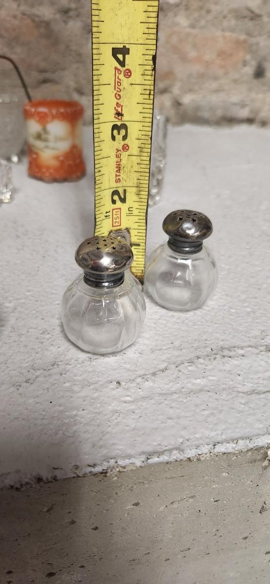 Sale Photo Thumbnail #307: Crystal toothpicks and salt cellar, a pair of antique knife rests...look at the cute shaker tops