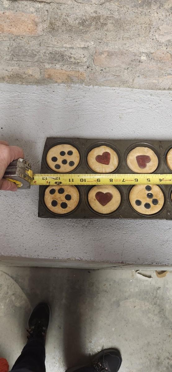 Sale Photo Thumbnail #311: Three old rocker cutters some inedible baked goods and their holders