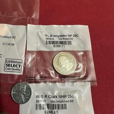 COIN CONTAINER OF BUFFALO NICKELS, 2009 PENNIES, 2014 S-MINT QUARTER, 2017 QUARTER, 1943 STEEL PENNY AND 3-1940’s NICKELS