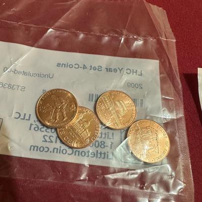 COIN CONTAINER OF BUFFALO NICKELS, 2009 PENNIES, 2014 S-MINT QUARTER, 2017 QUARTER, 1943 STEEL PENNY AND 3-1940’s NICKELS