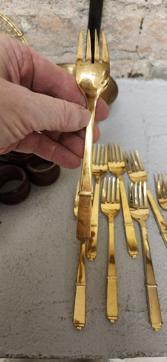 Sale Photo Thumbnail #387: Set of Golden forks, a big spider, brass dipper, wooden napkin rings and a pitcher