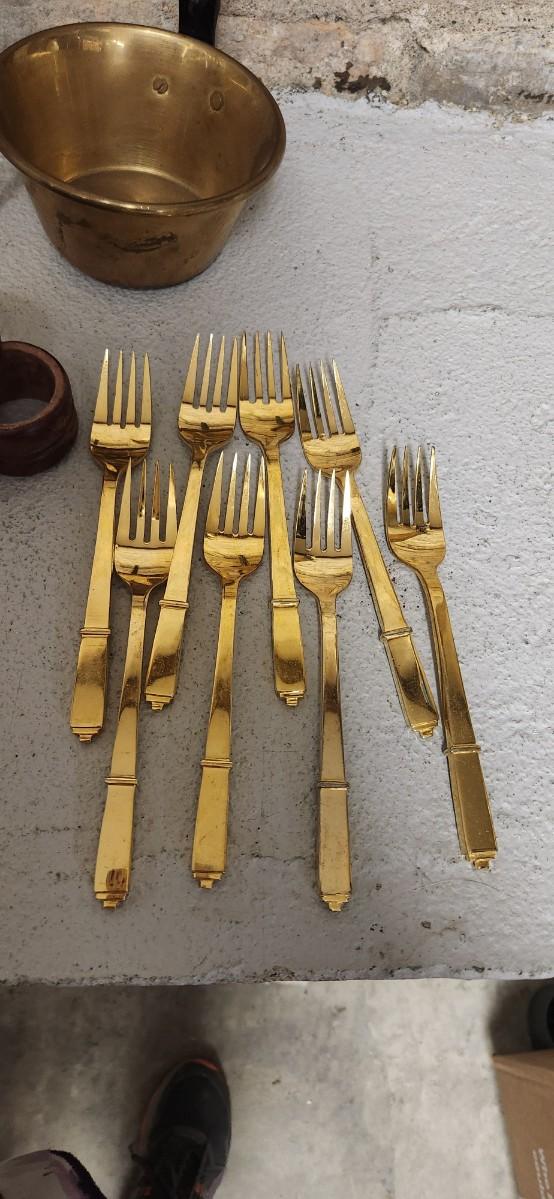 Sale Photo Thumbnail #386: Set of Golden forks, a big spider, brass dipper, wooden napkin rings and a pitcher