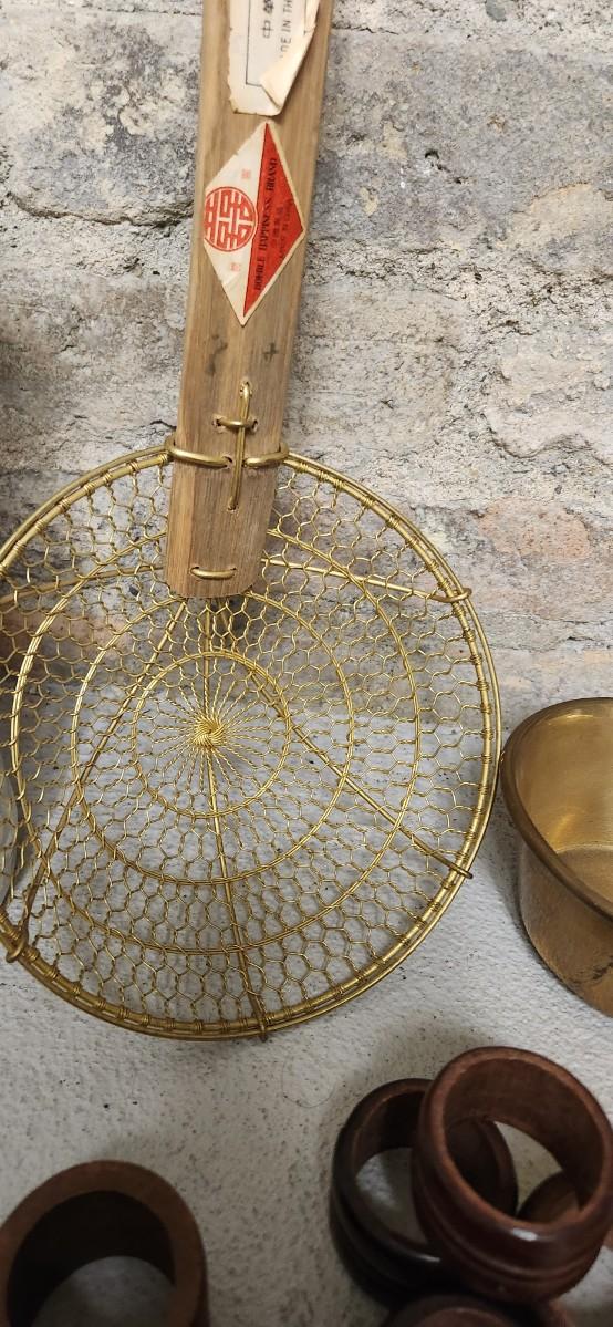 Sale Photo Thumbnail #391: Set of Golden forks, a big spider, brass dipper, wooden napkin rings and a pitcher