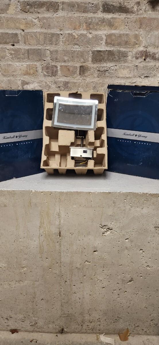Sale Photo Thumbnail #487: 2 luxury lighted mirrors. Looks like one install was attempted but the other is brand new in the box with instructions etc. hardware appears to be there for both