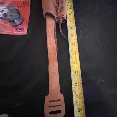 TOY DERRINGER SEALED ON BOARD AND A CHILD'S LEATHER BULLET BELT