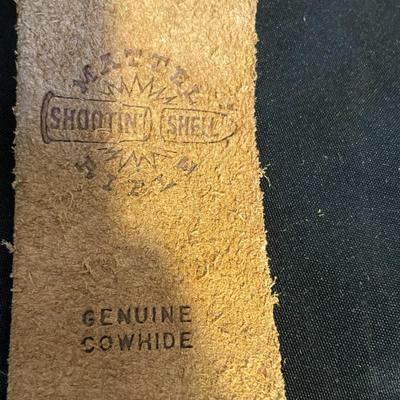 TOY DERRINGER SEALED ON BOARD AND A CHILD'S LEATHER BULLET BELT