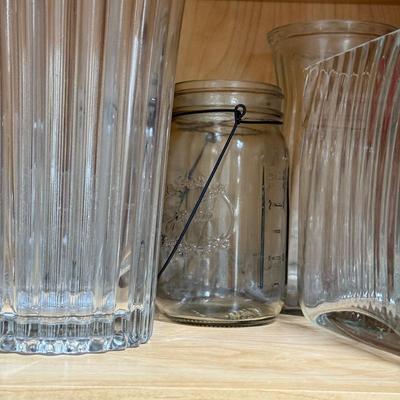 LOT 568K: Cabinet of Clear Glass Vases & More