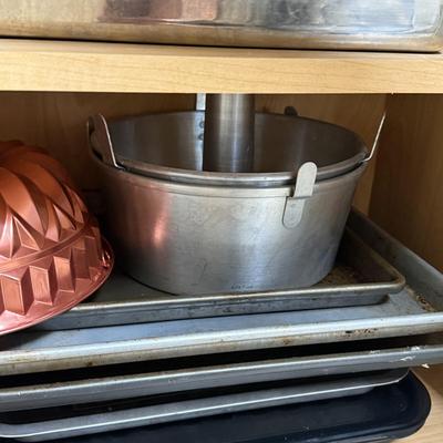 LOT 570K: Cabinet full of Baking Pans & Trays