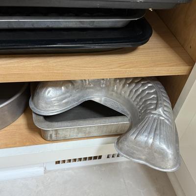 LOT 570K: Cabinet full of Baking Pans & Trays