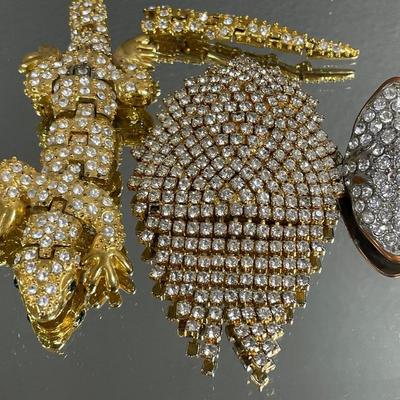 Heavily rhinestoned jewelry but all are broken/missing stones