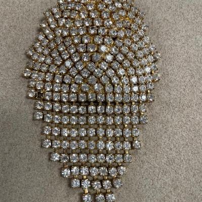 Heavily rhinestoned jewelry but all are broken/missing stones