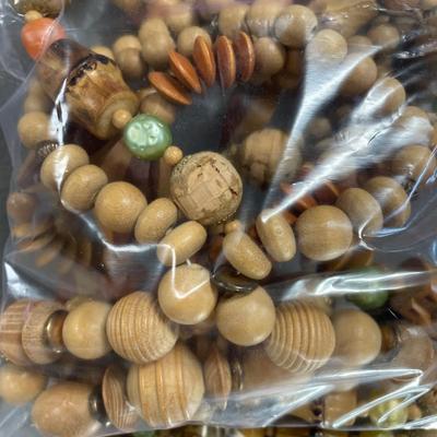 Bag of natural wood necklaces