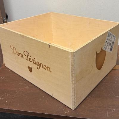 Sale Photo Thumbnail #491: Wooden crate for storing wine or champagne bottles.  Marked with the Dom Perignon logo.