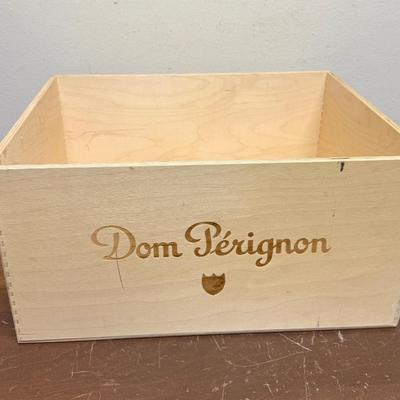 Sale Photo Thumbnail #492: Wooden crate for storing wine or champagne bottles.  Marked with the Dom Perignon logo.