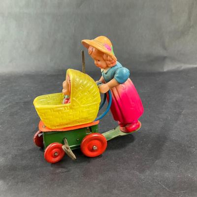 Vintage Celluloid and Tin Wind-Up | Girl and Buggy