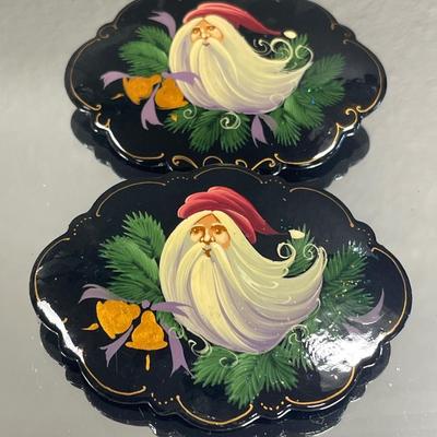 Painted wood pins are both signed