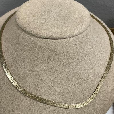 Glowing in gold tone necklaces