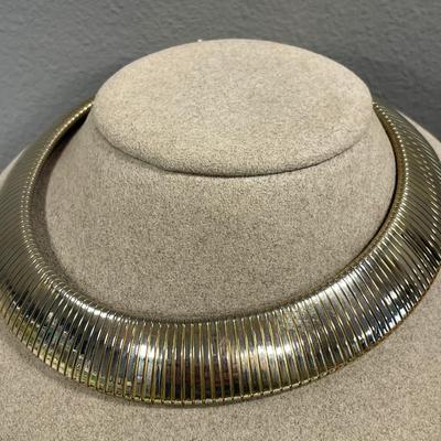 Glowing in gold tone necklaces