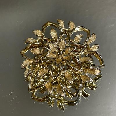 Pink stone gold tone brooch & Sarah C brooch