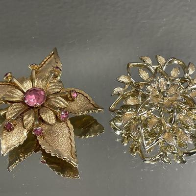 Pink stone gold tone brooch & Sarah C brooch