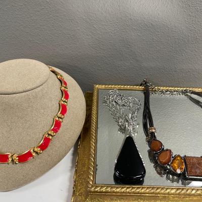 Red enamel, black Avon and brown chicos necklaces