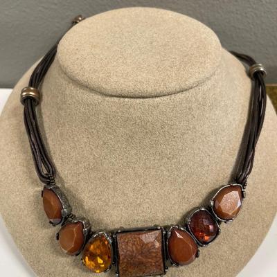 Red enamel, black Avon and brown chicos necklaces