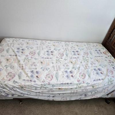 Twin sized bed with Brand new mattress & Boxsprings still in manufactured coverings - complete with quilted bedding