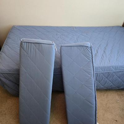 Twin sized bed with Brand new mattress & Boxsprings still in manufactured coverings - complete with quilted bedding