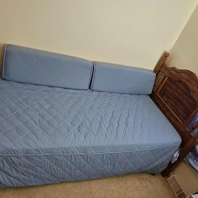 Twin sized bed with Brand new mattress & Boxsprings still in manufactured coverings - complete with quilted bedding