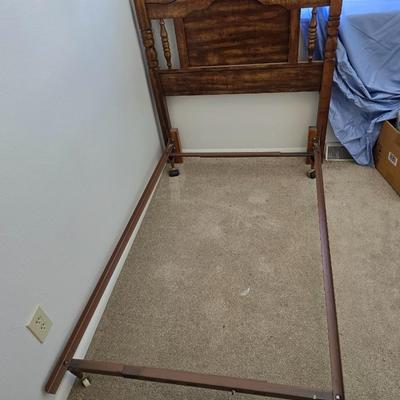 Twin sized bed with Brand new mattress & Boxsprings still in manufactured coverings - complete with quilted bedding