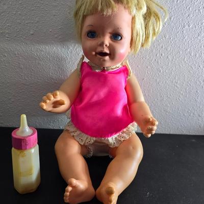 Vintage pajama bag doll with a 1966 Mattel Cheerful Tearful Baby Doll with some accessories