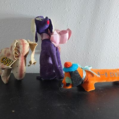 Three vintage felt stuffed dogs - 4-H Center souvenir dog, purple poodle dog, and a "Personality Pet" Dog by the Collegiate...