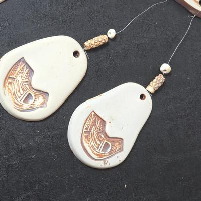 Framed John L. Medoza " Knowledge through time" UNC poster with a Native inspired ceramic wind chime