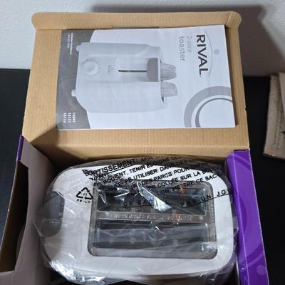 Brand new Rival toaster - New Ultimate 5 piece trivet set - and two new garden themed flour sack towels GREAT GIFT IDEAS!