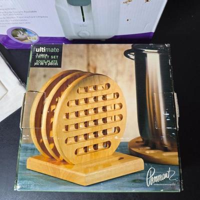 Brand new Rival toaster - New Ultimate 5 piece trivet set - and two new garden themed flour sack towels GREAT GIFT IDEAS!