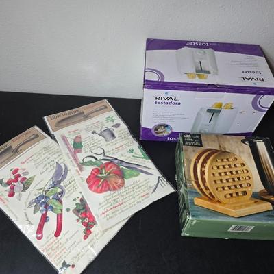 Brand new Rival toaster - New Ultimate 5 piece trivet set - and two new garden themed flour sack towels GREAT GIFT IDEAS!