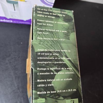 Brand new Rival toaster - New Ultimate 5 piece trivet set - and two new garden themed flour sack towels GREAT GIFT IDEAS!