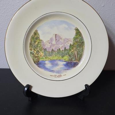 Antique cast iron souvenir bell from the 1915 Panama-California Exposition & a vintage souvenir plate featuring a depiction of Half...