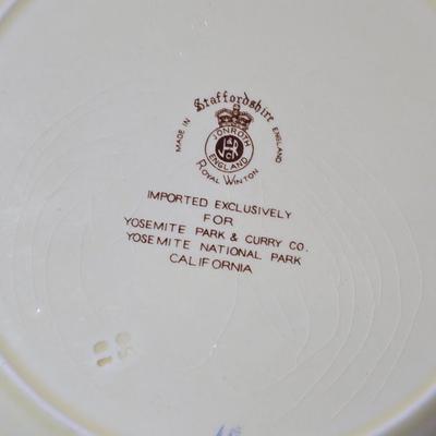 Antique cast iron souvenir bell from the 1915 Panama-California Exposition & a vintage souvenir plate featuring a depiction of Half...