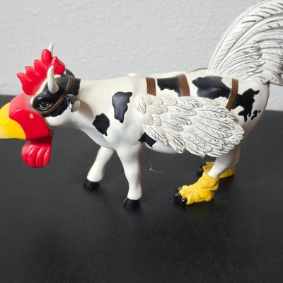 "Cow-Moo-Flage" figurine from the CowParade collection with "Charlie the Rooster" figurine from the Bobble Bods...